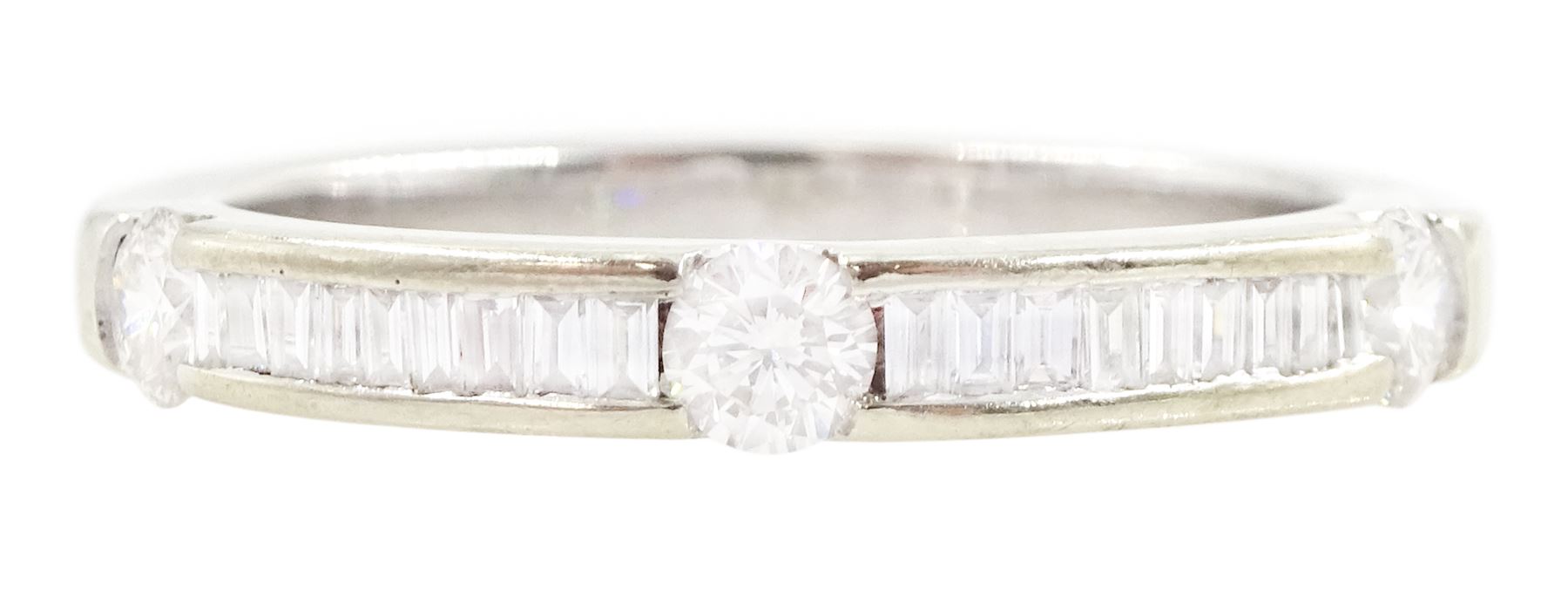 18ct white gold diamond half eternity ring, three round brilliant cut diamonds spaced by channel set, baguette cut diamonds, Sheffield 2005, total diamond weight 0.47 carat