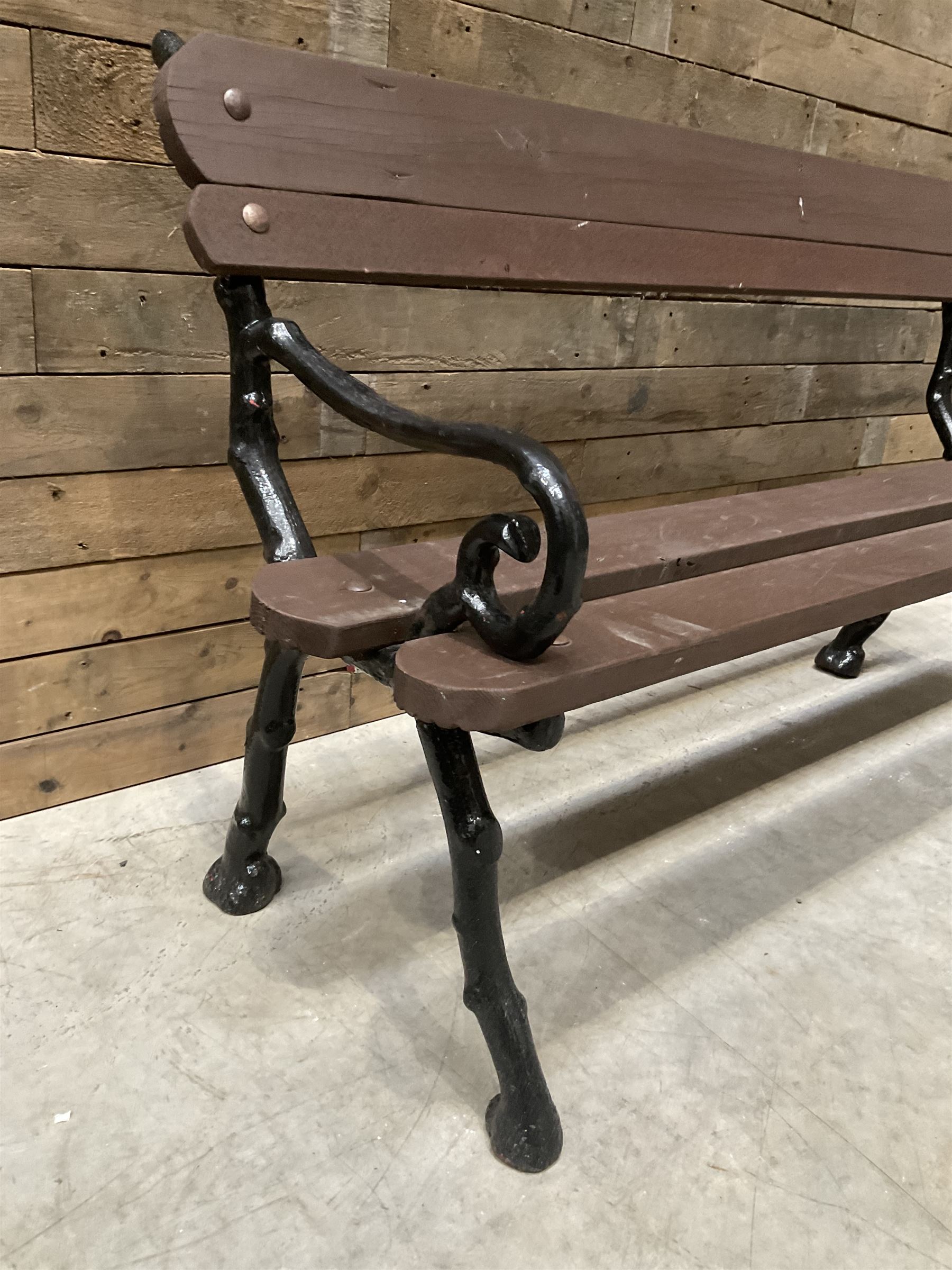 20th century tree cast iron and timber slatted garden bench, black painted frame with stained wood
