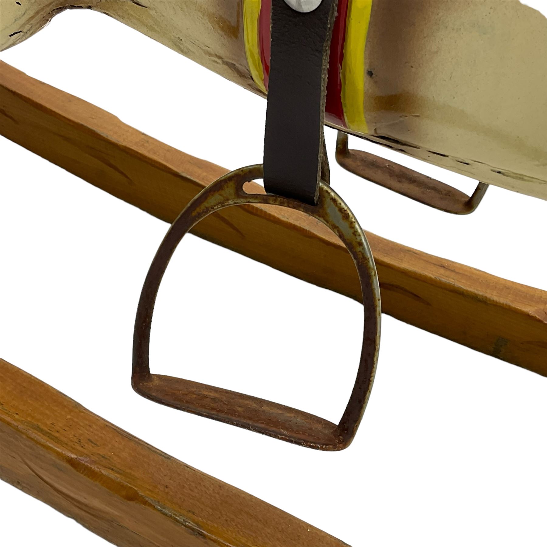 20th century rocking horse, painted body, glass eyes, metal stirrups and chain, wooden bow rocker