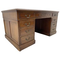 Late Victorian mahogany twin pedestal desk, , rectangular top with inset leather writing surface, fitted with central frieze drawer and eight flanking graduating drawers