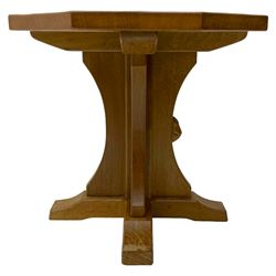 Mouseman - oak occasional table, octagonal adzed top on cruciform base with sledge feet, carved with mouse signature, by the workshop of Robert Thompson, Kilburn 