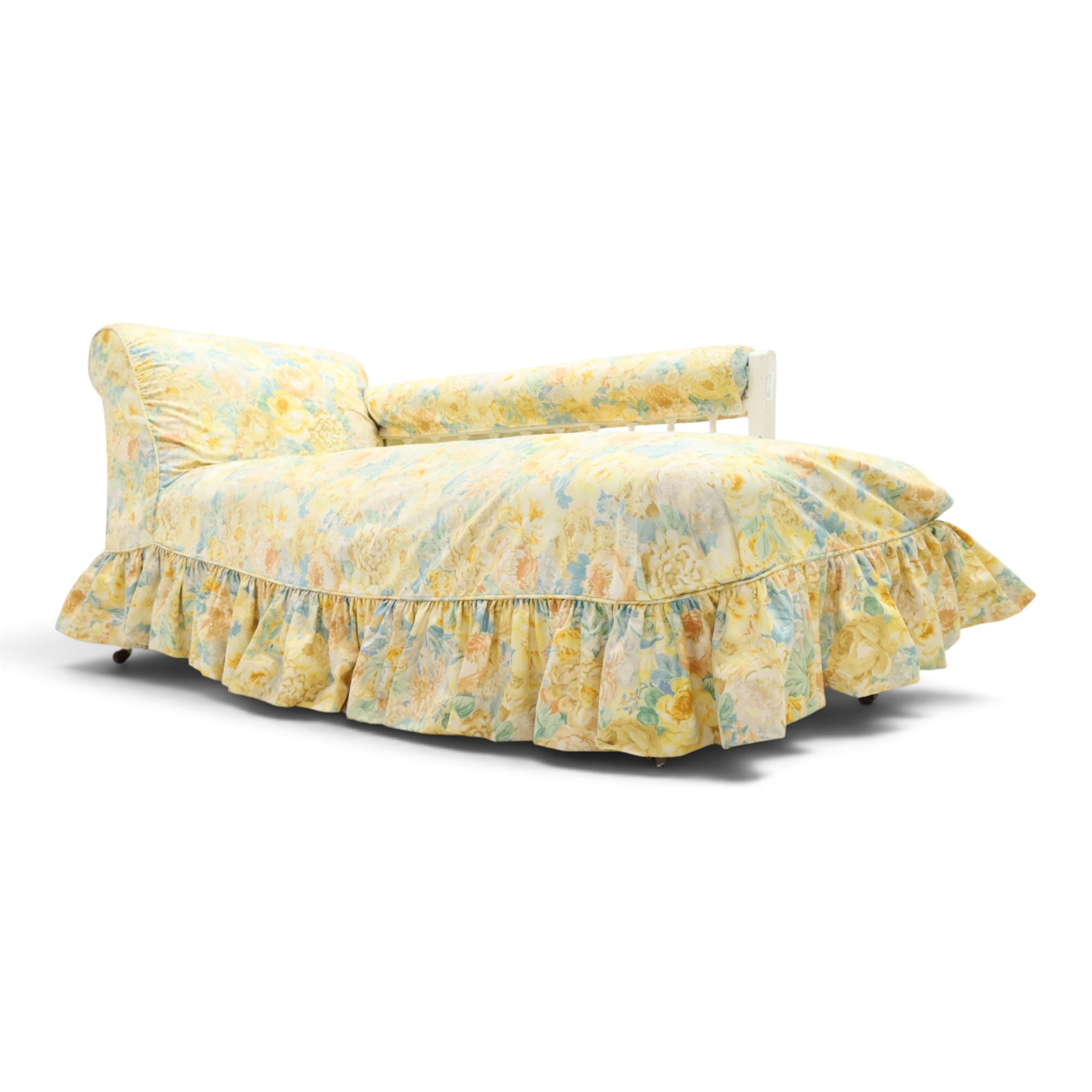 Victorian chaise longue in chintz upholstery, scrolled back with turned spindles up, raised on castors