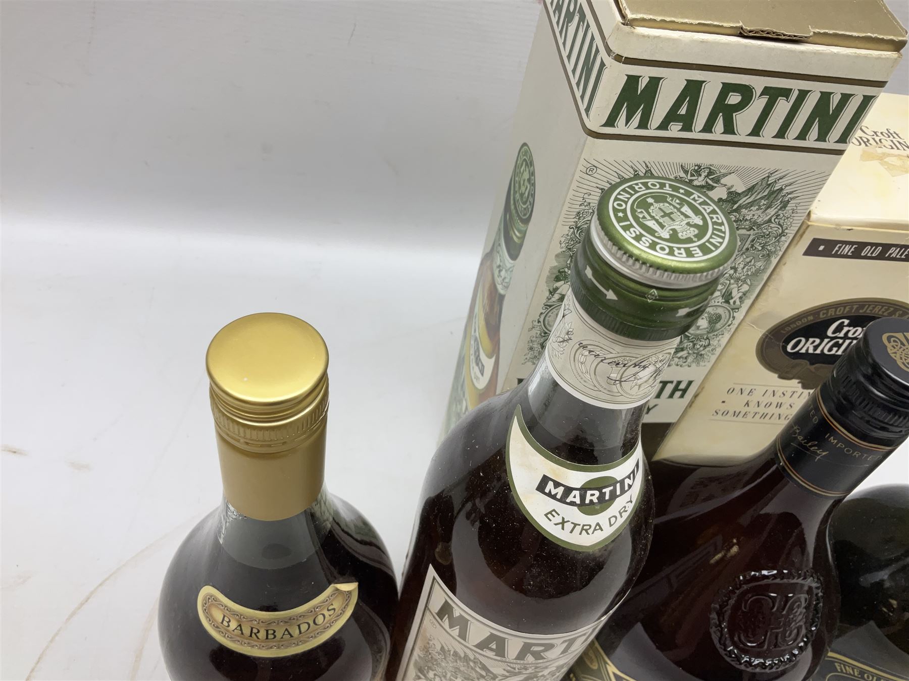 Mixed alcohol comprising Harveys Medium Dry Sherry, 70cl, one bottle, Croft Original Fine Old Pale Cream Sherry, 70cl, one bottle in box, Martini Extra Dry Vermouth, 90cl 18% vol, one bottle in box, Cockspur Barbados V.S.O.R Fine Rum, one bottle, and Baileys Irish Cream, 1l, one bottle (5)