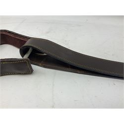 Brown leather western saddle with decorative design and stiching with stirrups and girth, saddle L48cm