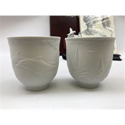 Lladro Collectors Society items, comprising of The Will to Create book, two candle holders; Sailing the Sea no 17665, Dolphins at Play no 17666, Plaque Bringing Us Together, key fob, leather wallet and a members joining pack with plaque, all in original boxes  