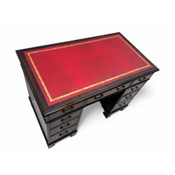 Georgian design mahogany kneehole desk, moulded rectangular top with red gilt-tooled leather writing surface, over an arrangement of nine cock-beaded drawers with brass swan neck handles, on bracket feet
