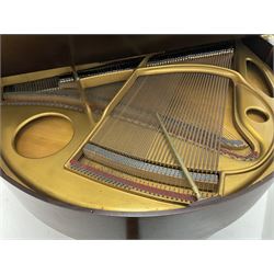 Early 20th century mahogany cased Strohmenger London baby grand piano, demi lune shape, over strung cast iron framed, raised on square tapered supports and castors 