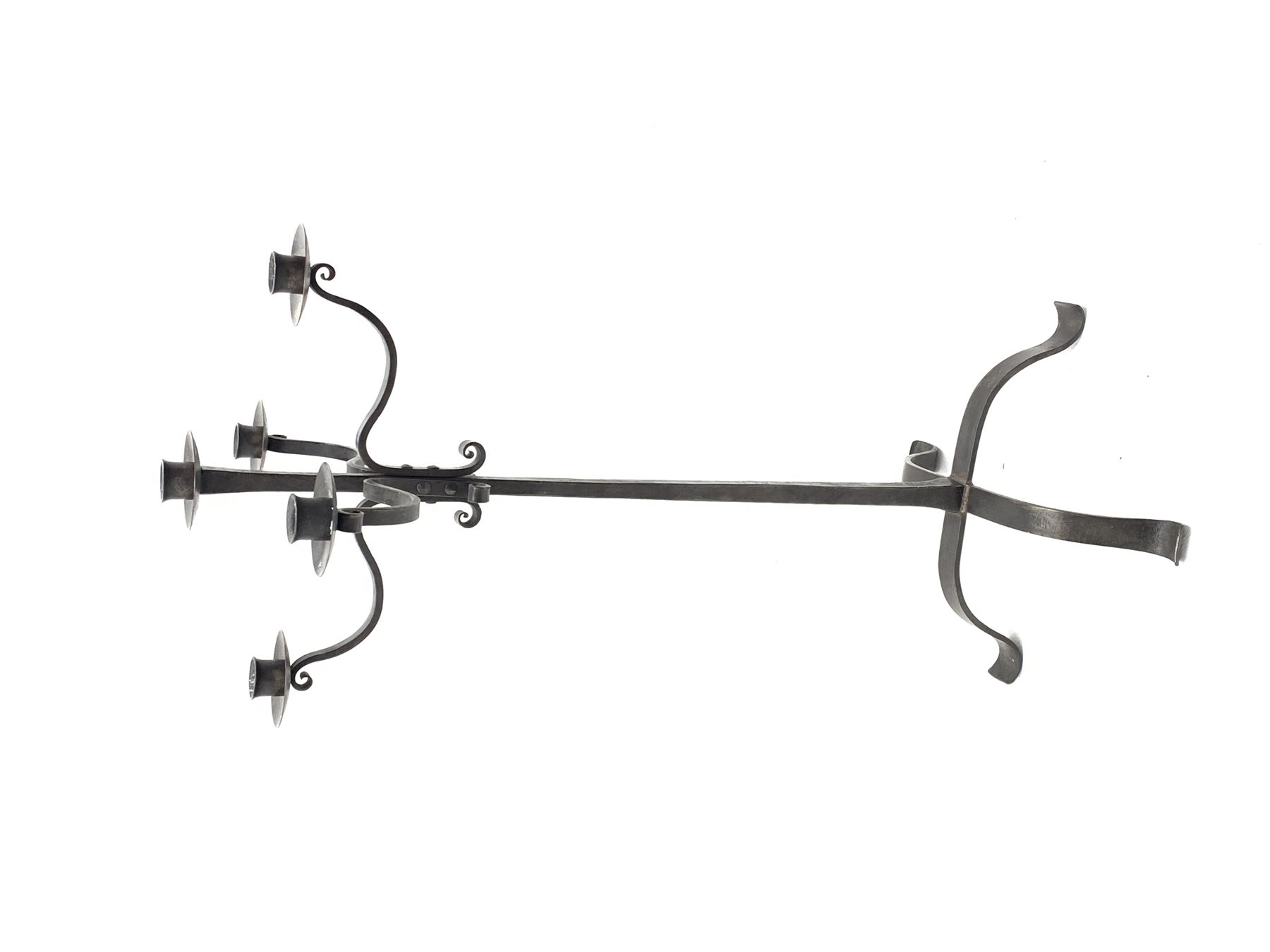 Wrought hand forged iron candle stand, four scrolled branches and central vertical branch with sconces, tapered column on four shaped and out splayed supports