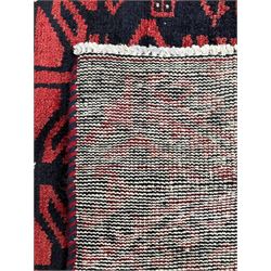 Turkman red and blue ground rug, overall geometric design, decorated with stylised motifs