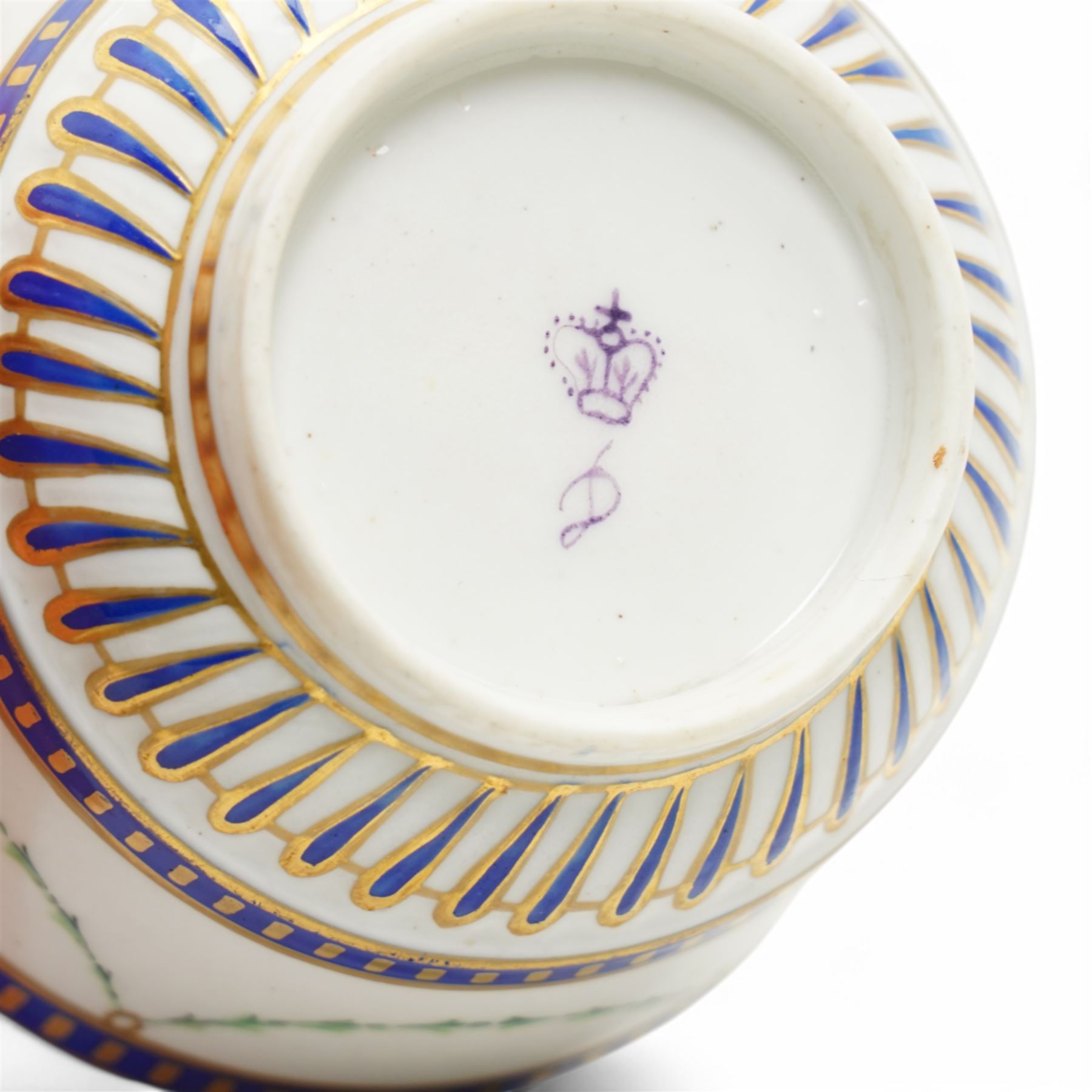 Two sets of Derby tea wares, comprising two saucers, teacup and small bowl, decorated in blue and white, with teardrop and swag motifs, heightened with gilt, one set marked pattern no. 34,  with late 18th century D mark in puce, the other with crown, D mark and crossed batons in puce (4)