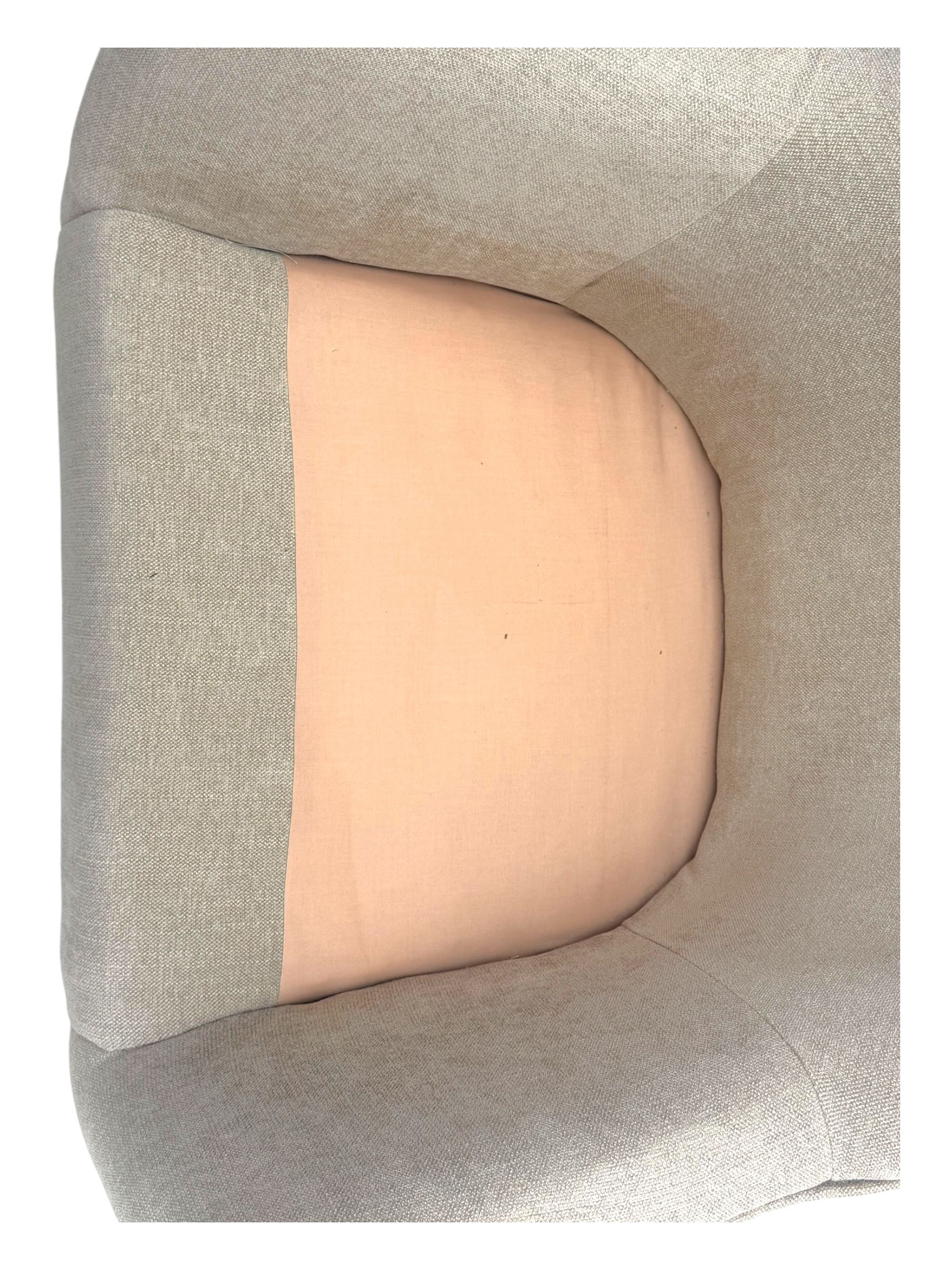 Contemporary tub armchair upholstered in beige fabric