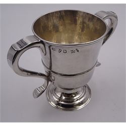 George III silver twin handled cup, the bowl of typical form with girdle and twin S scroll handles, upon a circular stepped foot, hallmarked John Langlands I, Newcastle 1778, H13cm, approximate weight 11.69 ozt (363.6 grams)