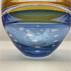 Stuart Akroyd glass vase, yellow banded top and blue lower section with bubble inclusions, with sticker and engraved signature beneath, H17cm