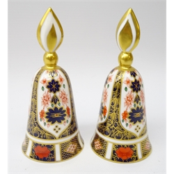  Two Royal Crown Derby Old Imari candle snuffers, bell form with flame handle no. 1128, H12cm   