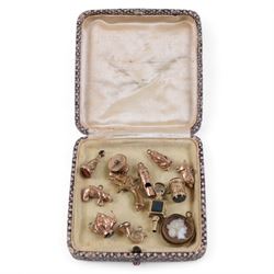 Collection of gold plated charms, including teapot, monkey, cameo etc