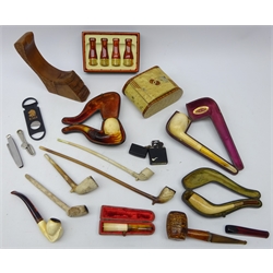  Collection of pipes and smoking paraphernalia - set of four Eono graduated mouthpieces, with gold plated mounts boxed, cased and loose meerschaum pipes, cased amber mounted mouthpiece, churchwarden pipes, cigar cutters, carved hardwood pipe stand, Art Deco tin cigarette box, Zippo lighter etc   