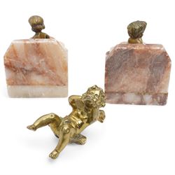 Brass and marble bookends with reclining putti figures, together with a brass figure of a cherub, bookends H8cm 