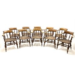 Set ten 19th century elm and beech smokers bow armchairs, raised backs on curved arms with scroll terminals, spindle turned balustrade back, turned elm seats, on turned supports joined by double H stretchers  