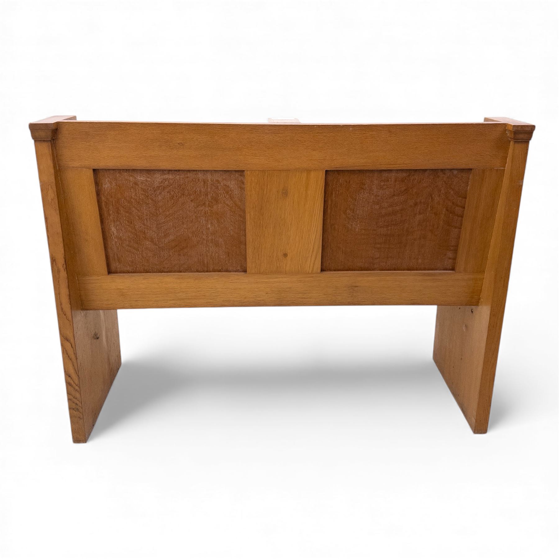 Pair of mid 20th century oak ecclesiastical pews, each with panelled backrests and shaped end supports, of solid construction and mellow honeyed tone