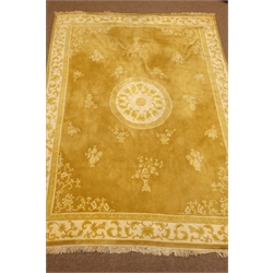  Chinese washed woollen gold ground carpet, decorated with tailing foliage. centre shou motif, 363cm x 267cm  