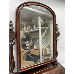 Victorian figured mahogany dressing table mirror, arched swing mirror in moulded frame, lobe carved baluster supports with foliate carved finials, on cushioned and serpentine base with hinged compartment