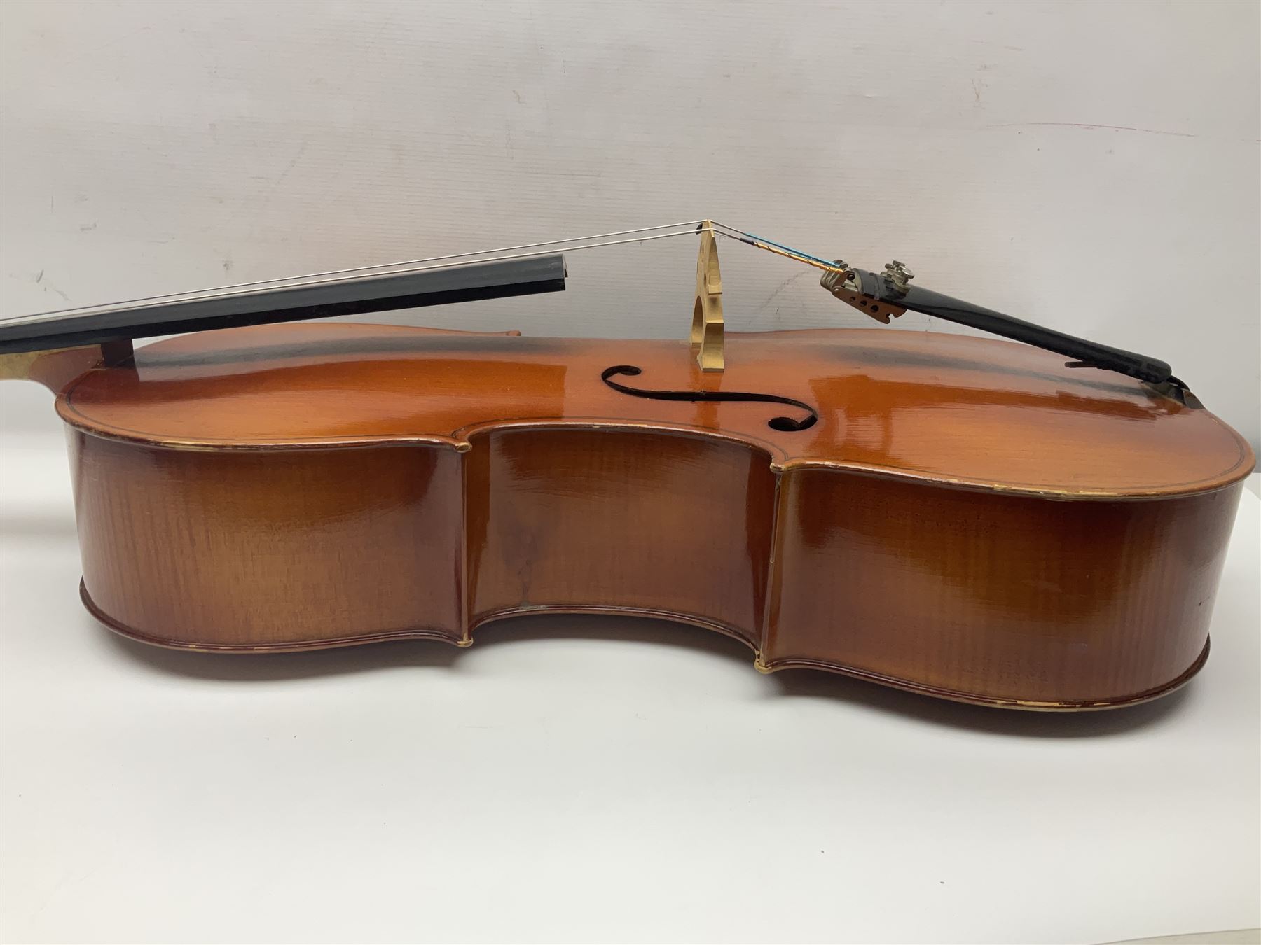 German half-size cello with 69cm two-piece maple back and ribs and spruce top; L112.5cm overall; in soft carrying case with two bows