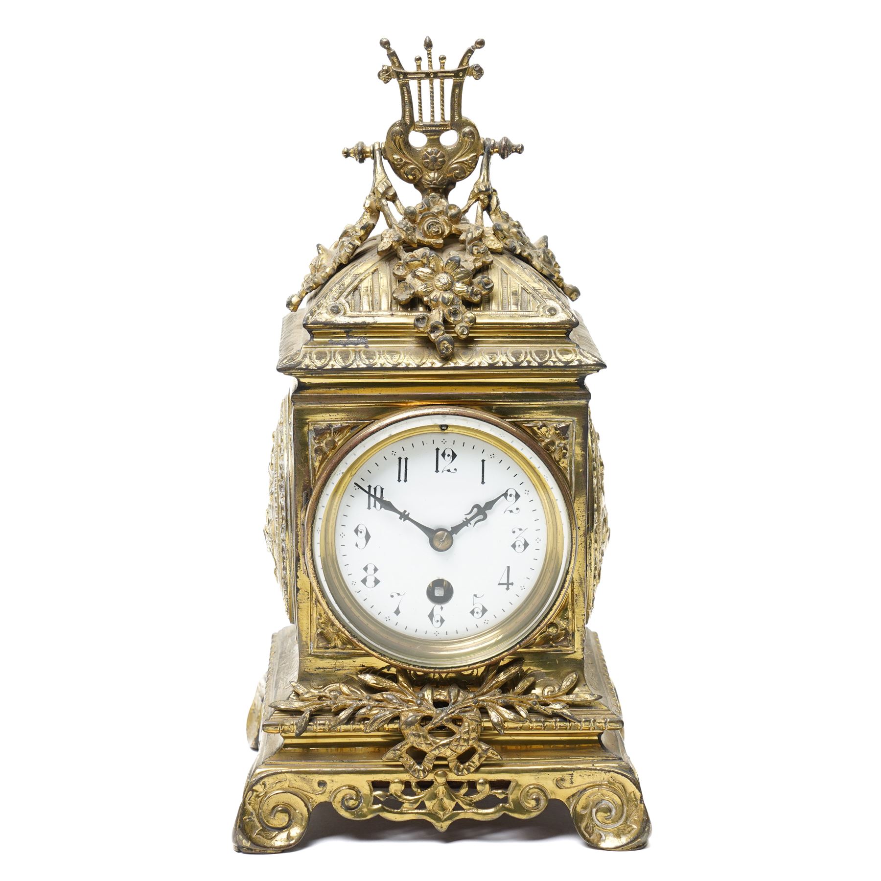 Early 20th century mantel clock with white enamel dial, French timepiece movement and recoil anchor escapement in brass case with lyre finial, trailing garlands and wreaths etc on scroll feet H30cm 
Provenance: property of a Nobleman