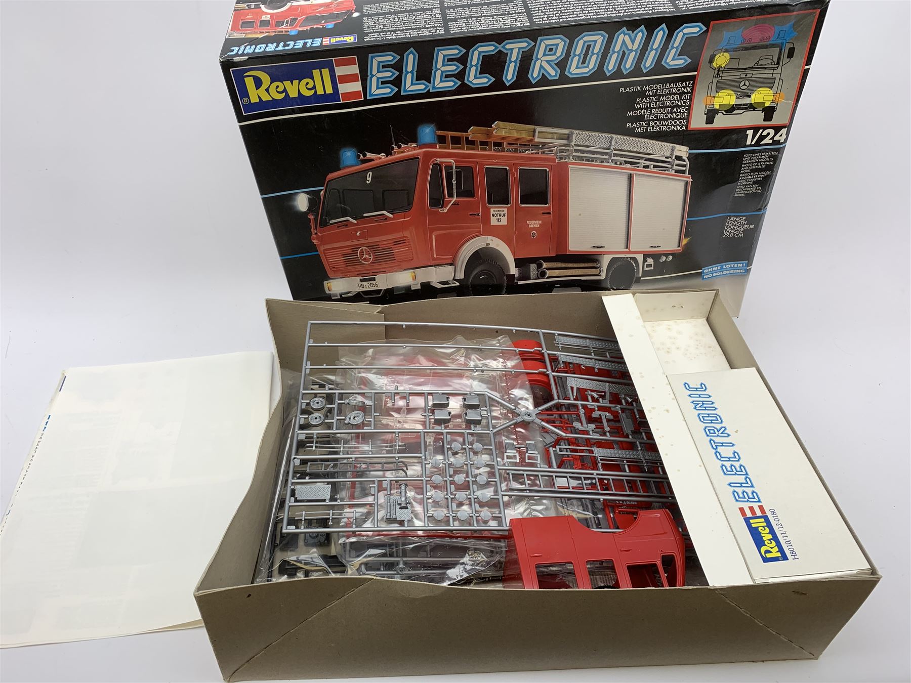 Two Revell Electronic 1/24th scale model kits of fire-engines - Mercedes Benz 1017 LF16 and part constructed Mercedes Benz 1422 DLK 23-12; together with Revell 1/24th scale firemen figures; and Airfix 1/32nd scale model kit of a Dennis Fire Engine; all boxed with instructions (4)