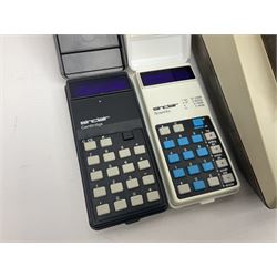 Four 1970s Sinclair electronic calculators - Cambridge in hard case with booklet; Scientific Programmable with Program Library and booklet; Scientific in hard case; and Oxford 300 in soft case with booklet; together with Texas PC-100 SR56 programmable slide-rule calculator on base station with readout, two booklets, keys and cover, serial no.9103093