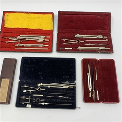 Victorian Stanley burr walnut cased set of nickel drawing instruments, some with turned ivory handles, in oblong box with lift-out tray and compartments under for ivory scale rulers, parallel ruler and chart roller ruler etc W21cm; four other cased sets of drawing instruments; and cased Simplon Bilateral slide rule (6)