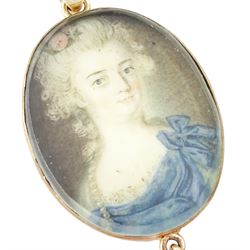18th/ 19th century portrait pendant, set with an oval miniature of a woman wearing a blue dress on ivory, suspending a pearl drop. 
This lot has been registered for sale under Section 10 of the APHA Ivory Act
