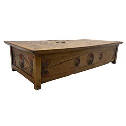Large teak low table or Jodang chest, possibly Indonesian, the rectangular top with hinged compartment revealing storage space, fitted with wrought metal handles and hinges, the sides and ends carved and painted with fan motifs, on stile supports