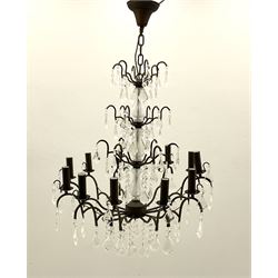 Contemporary bronze finish twelve branch chandelier, decorated with glass droplets 