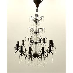 Contemporary bronze finish twelve branch chandelier, decorated with glass droplets 