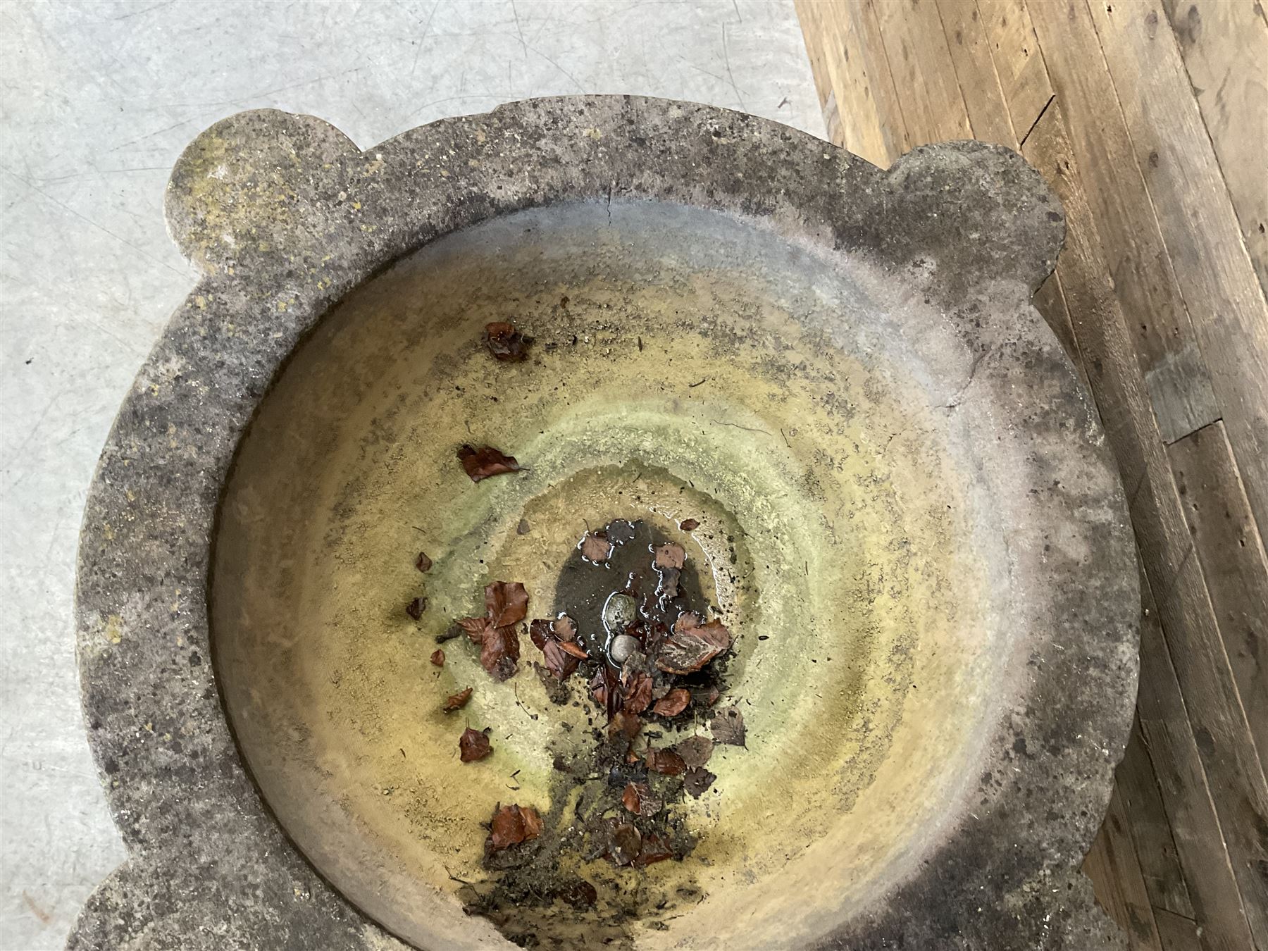 Large 19th century circular stone mortar planter on wrought iron stand