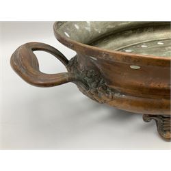 Agricultural copper corn funnel, H32.5cm, another similar copper funnel and copper warming platter of oval form, with twin handles on four supports, with removeable warming plate, L49cm