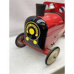 Mid 20th century 'The Duke Express’ child’s pedal car, the steel body in the form of a train painted red with black rubber chimney, chrome bell, yellow decals, white wheels and rubber tyres, the interior with steering wheel and pedals, L70cm