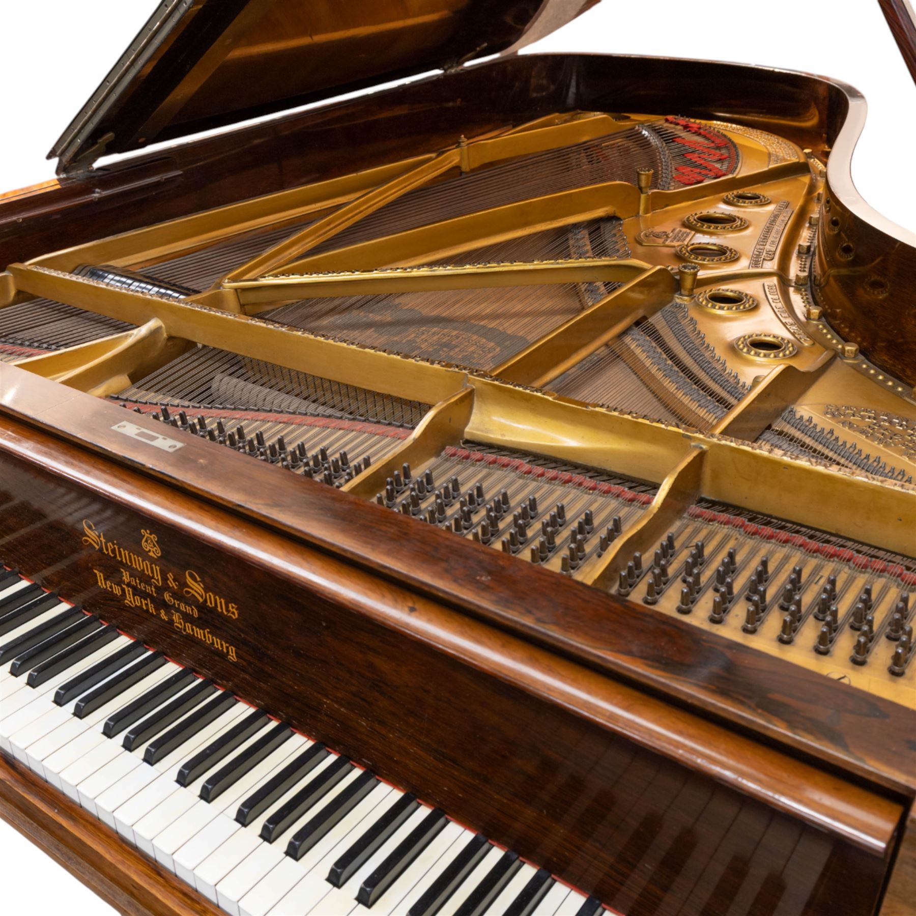 Steinway & Son, New York & Hamburg- Model B, overstrung Drawing Room Grand Piano in a rosewood case, Serial No 87297 (1896/7), with 85 ivory covered and ebony keys A0-A7(7 octaves) with an adjustable fretted music desk, brass fittings and pedals, Steinway “Fireplug” straight columnar and fluted legs with roller castors and conforming lyre, duplex stringing with agraffs, bass strings copper wound with a steel core, steel tuning pins, original Steinway action, hammers, keys, felts, and dampers, with una-corda, sostenuto and sustain pedals, Overstrung iron frame detailing numerous Steinway patents, awards, and features. Tuned to Concert pitch (A=440). 
With an adjustable single stool. 

This item has been registered for sale under Section 10 of the APHA Ivory Act HLB1KY67
