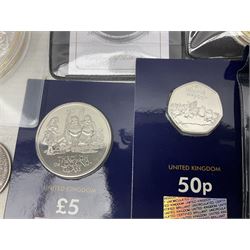 Coins and sets, including Great Britain and Northern Ireland 1970 proof coin collection in card folder, Queen Elizabeth II 2021 'Through the Looking Glass' five pounds, 2021 'Winnie the Pooh' fifty pence, Queen Victoria 1887 halfcrown, King George V 1914 halfcrown, commemorative coins, The Royal Mint Solomon Islands 2003 twenty-five dollars silver proof coin cased with certificate, 9ct gold half sovereign mount etc
