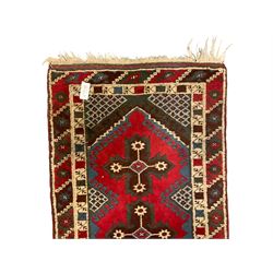 Turkish red ground runner, the field decorated with seven geometric star motifs, repeating geometric patterned border