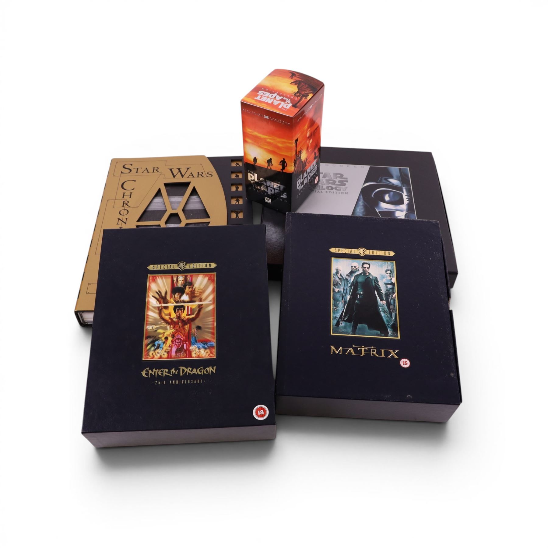 Special Edition DVDs and VHS tapes, comprising Enter The Dragon 25th Anniversary Edition DVD, The Matrix 25th Anniversary Edition DVD, The Planet of the Apes Collection VHS boxset and Star Wars Trilogy Widescreen Special Edition, together with Star Wars Chronicles book, by Deborah Fine and Aeon Inc