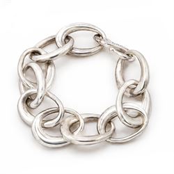Chanel silver bracelet, with ten oval interlocking links and a hook clasp, London 2000