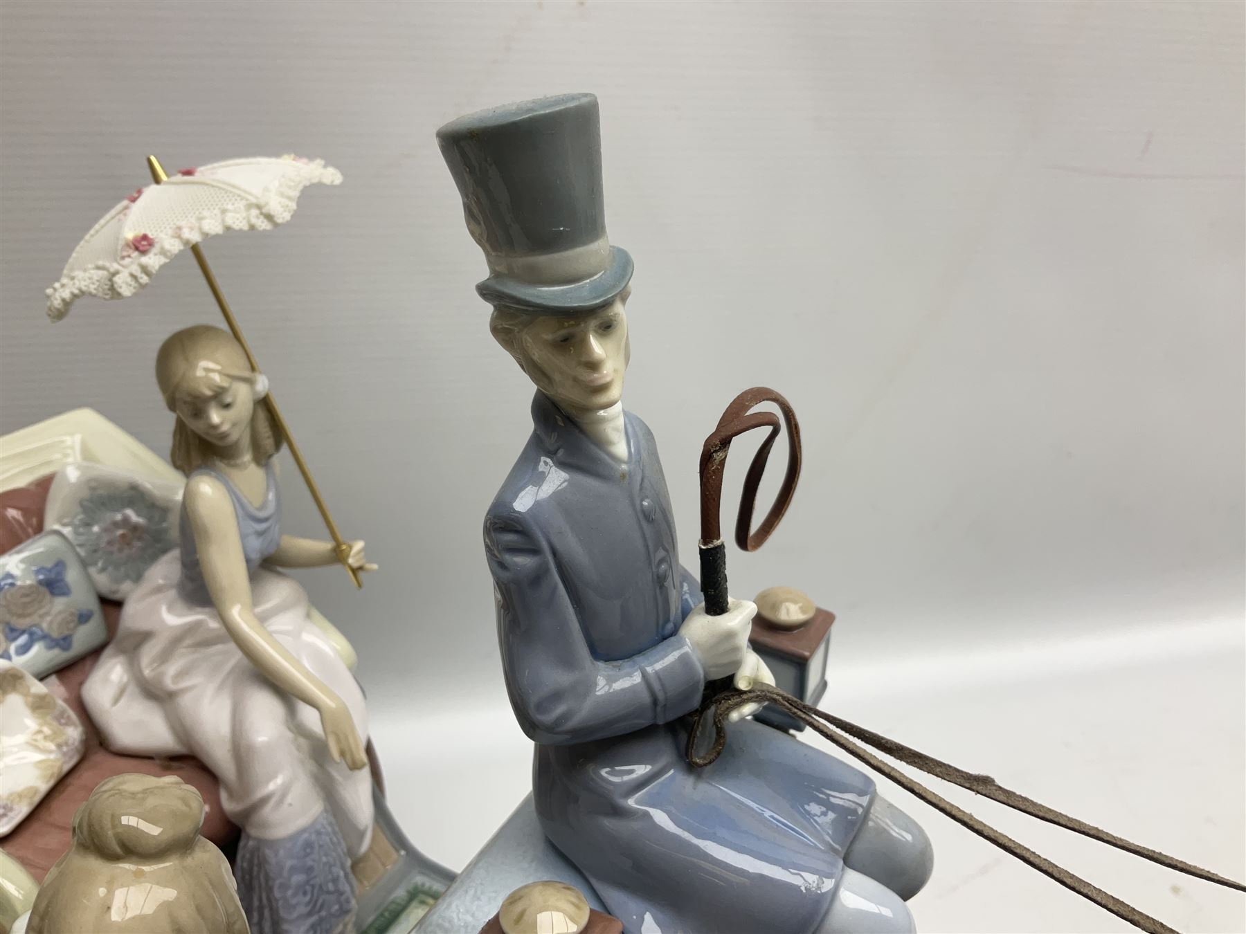 Large Lladro figure, The Landau Carriage, modelled as a horse drawn open top carriage, on a mahogany base, no 1521, sculpted by Juan Huerta, year issued 1987, year retired 1998, H30cm 
