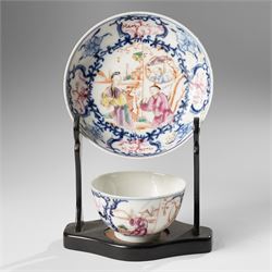 Two pairs of 18th/19th century Chinese export tea bowls and saucers, the first decorated in the 'Mandarin Palette' in typical colourways, the other famille rose examples painted with figures near a window, all unmarked (4)