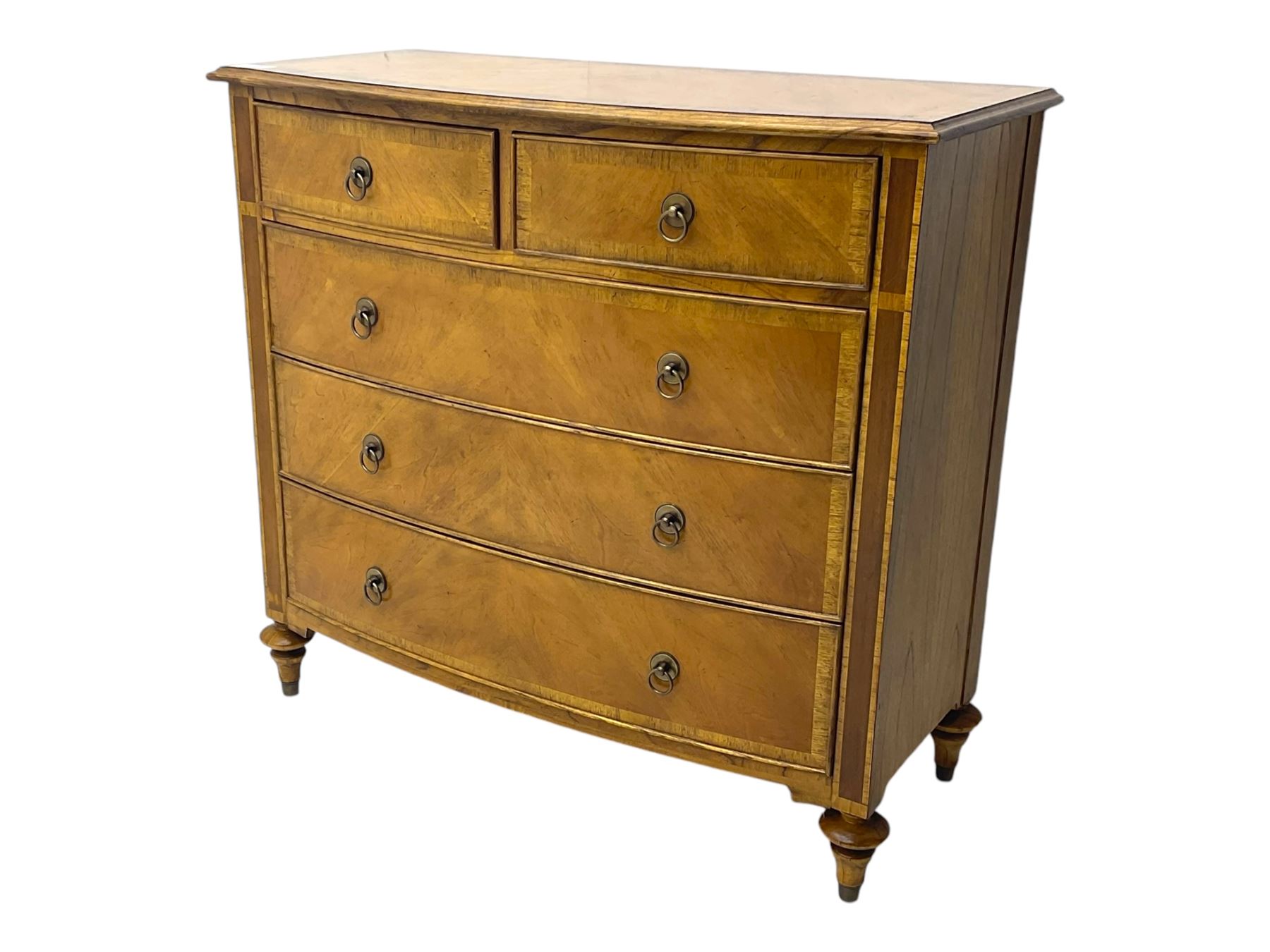 Frank Hudson - mid-20th century Mindi ash and burr walnut 'Spire' bow-fronted chest, featuring a crossbanded top over two short and three long cockbeaded drawers, raised on turned supports  