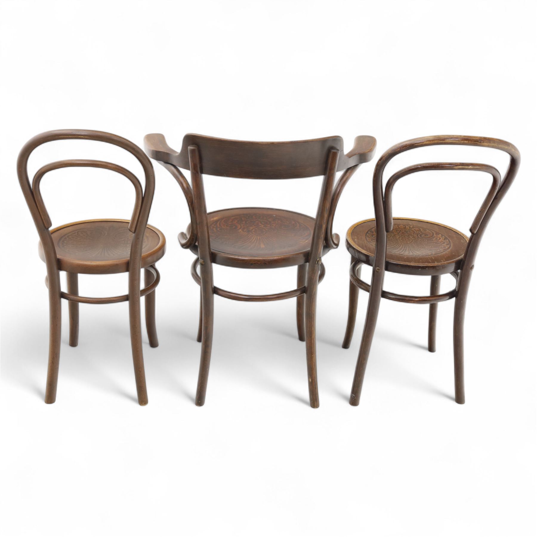 Set of three bentwood café chairs in the manner of Thonet, including a pair of side chairs (W 37cm, D 45cm, H 86cm) and a matching armchair (W 70cm, D 46cm, H 81cm), each with pressed seat decoration and continuous loop backrest