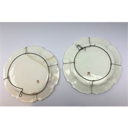 A pair of Italian faience pottery plates, by Giovanni Battista Viero, each of circular form with piecrust rim, with painted floral decoration, each with painted mark beneath, (a/f), D37.5cm