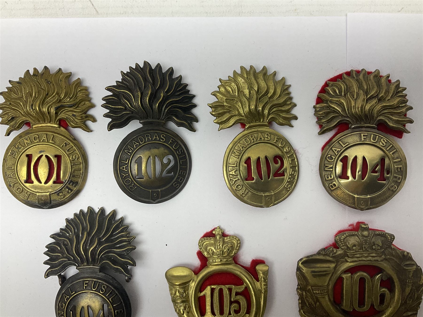 Ten cap badges of Indian interest comprising Bengal Fusiliers No.104, Bengal Infantry No.107, Royal Bengal Fusiliers No.101, Bombay Infantry No.109, Bombay L.I. No.106, two Royal Madras Fusiliers No.102, Madras Infantry No.108 and Madras L.I. No.105 (10)
