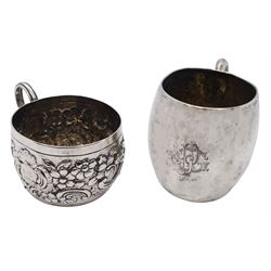 Embossed silver cup, possibly Anglo Indian, with reeded curved handle with shaped terminal, and embossed with flower heads and C scrolls, including handle H5.5cm D7cm, together with an early 20th century silver mug, of barrel form with engraved monogram and C formed handle, hallmarked Birmingham 1919, makers mark worn and indistinct, H7.5cm, approximate total weight 6.14 ozt (191.2 grams)