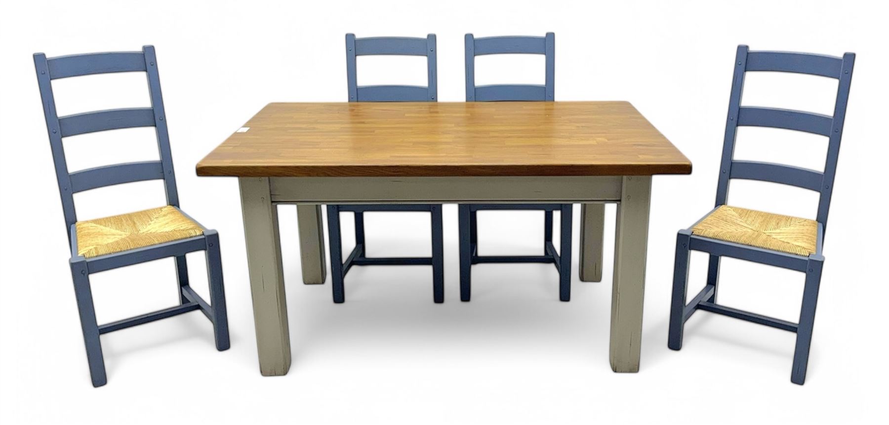 Fired Earth - contemporary kitchen table, rectangular oak parquetry top over four cream painted chamfered square section supports; together with set of four ladderback chairs, each with woven rush seat and lavender-grey painted finish